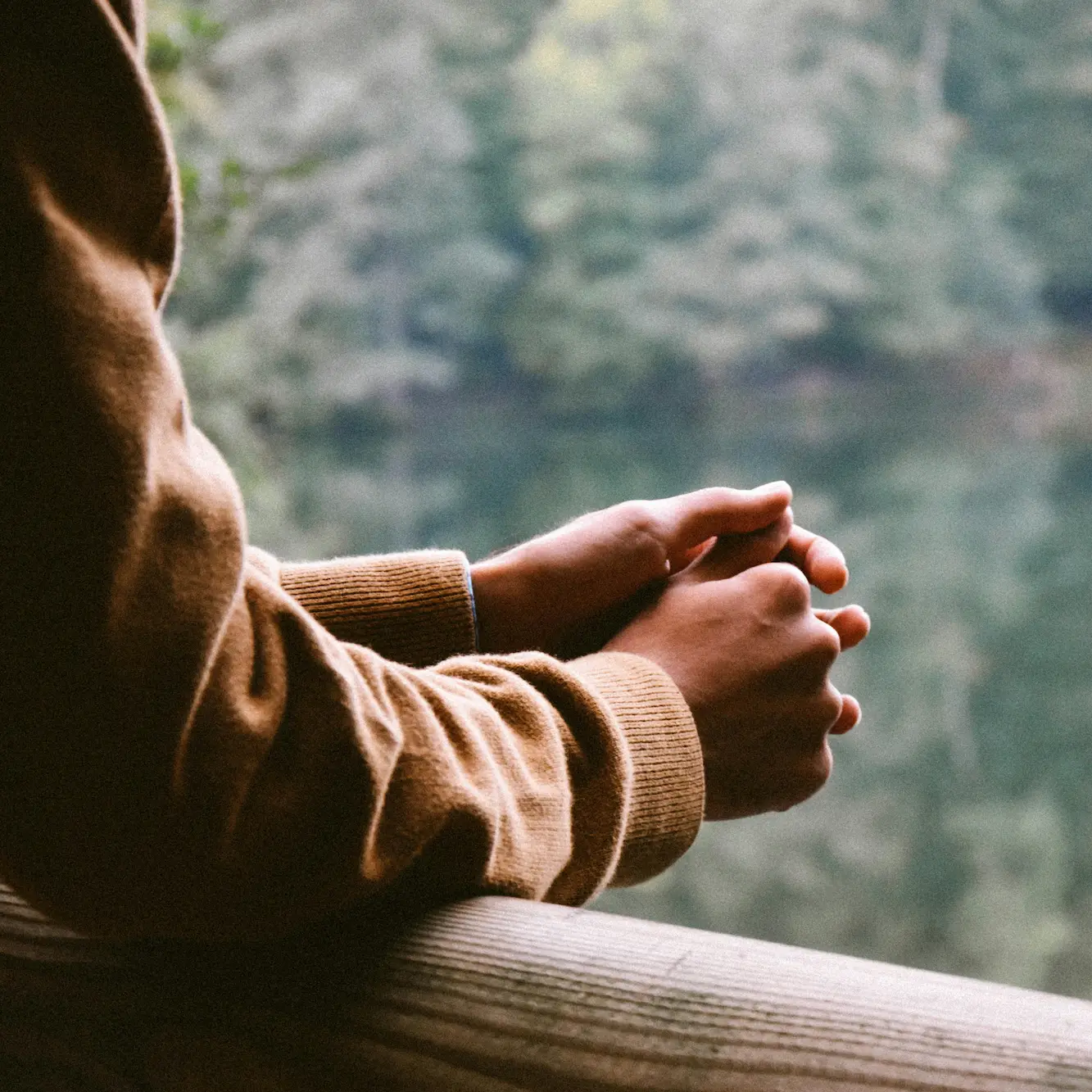 umit-bulut-qbTC7ZwJB64-unsplash Person sitting by a window in a reflective moment, symbolising person-centred counselling